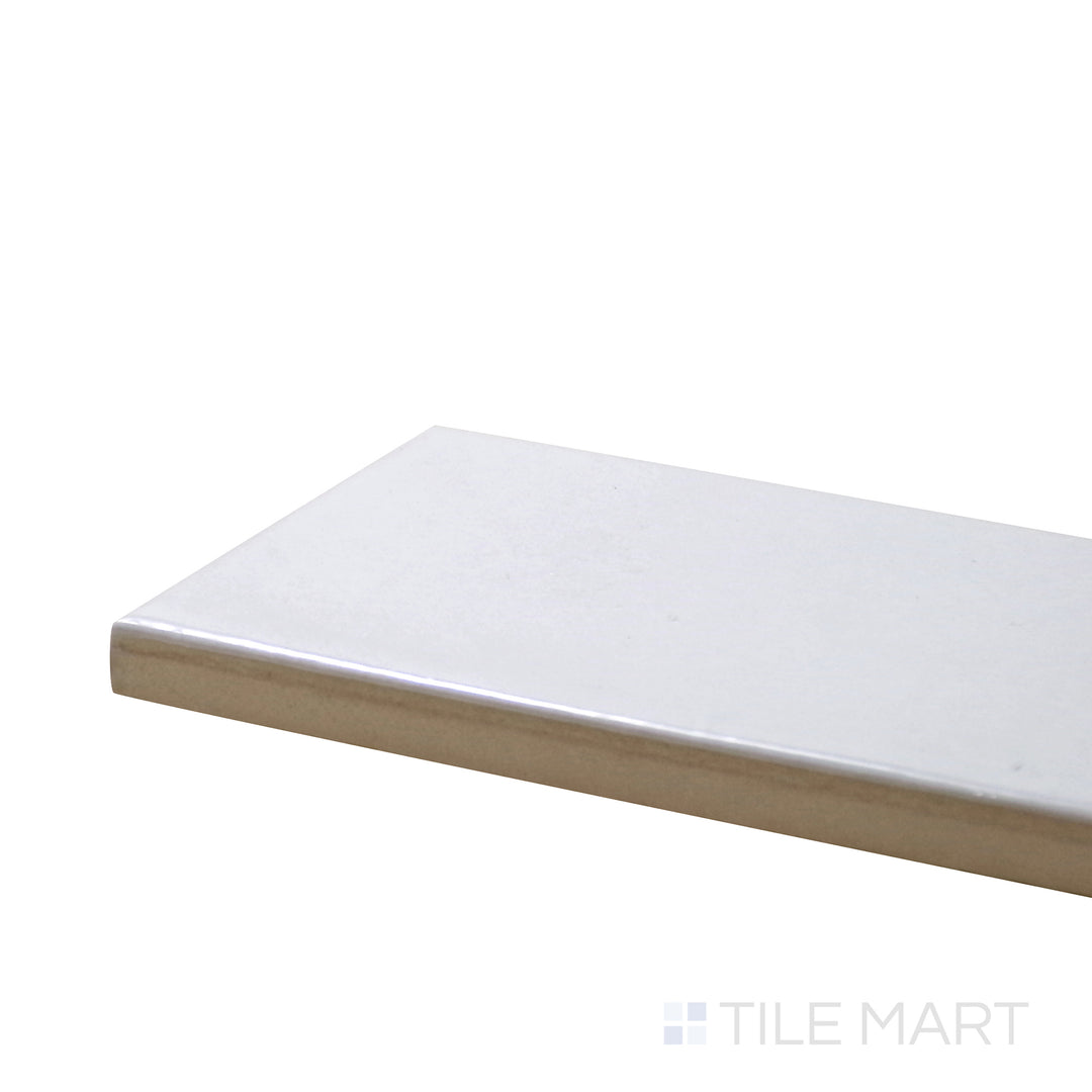 Close-up corner shot of Village White 2.5X8 Glossy Ceramic Tile, featuring its crisp white color and high-shine surface for a clean, modern look.