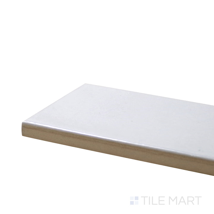 Close-up corner shot of Village White 2.5X8 Glossy Ceramic Tile, featuring its crisp white color and high-shine surface for a clean, modern look.