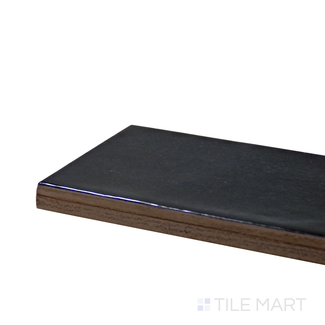 Corner angle of Village Black 2.5X8 Glossy Ceramic Tile, emphasizing its deep black tones with a glossy, high-contrast finish.