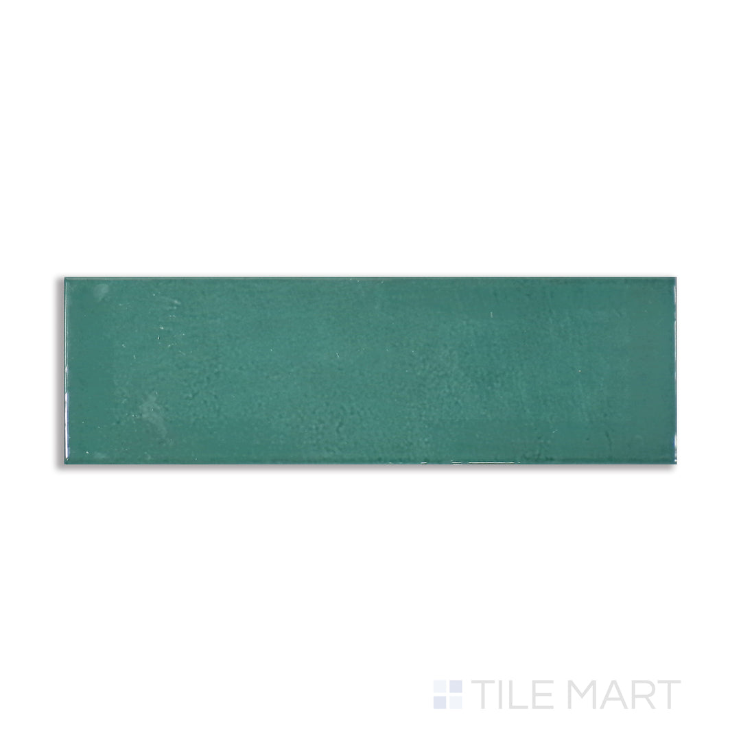 Overhead shot of Village Emerald Green 2.5X8 glossy ceramic tile, a striking jewel-toned green that adds a luxurious and refreshing touch.