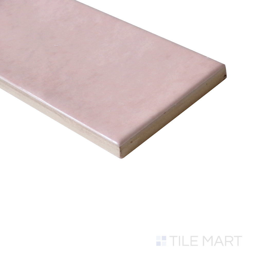 Diagonal view of Village Rose Gold 2.5x8 glossy ceramic tile, featuring soft rose gold hues, a shimmering glossy finish, and elegant rectangular shape.  