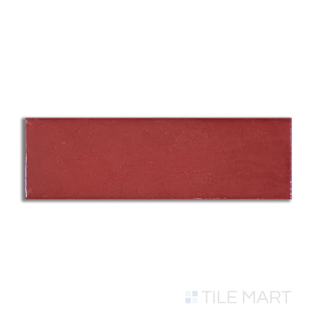 Aerial perspective of Village Volcanic Red 2.5X8 glossy ceramic tile, showcasing a bold, fiery red color with a polished finish for a striking statement.