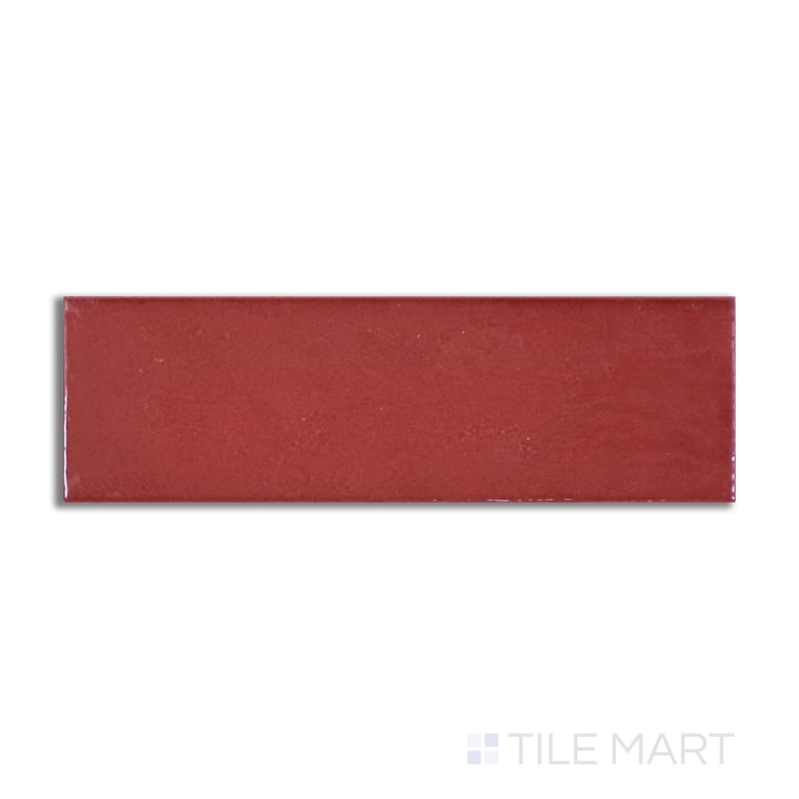 Aerial perspective of Village Volcanic Red 2.5X8 glossy ceramic tile, showcasing a bold, fiery red color with a polished finish for a striking statement.