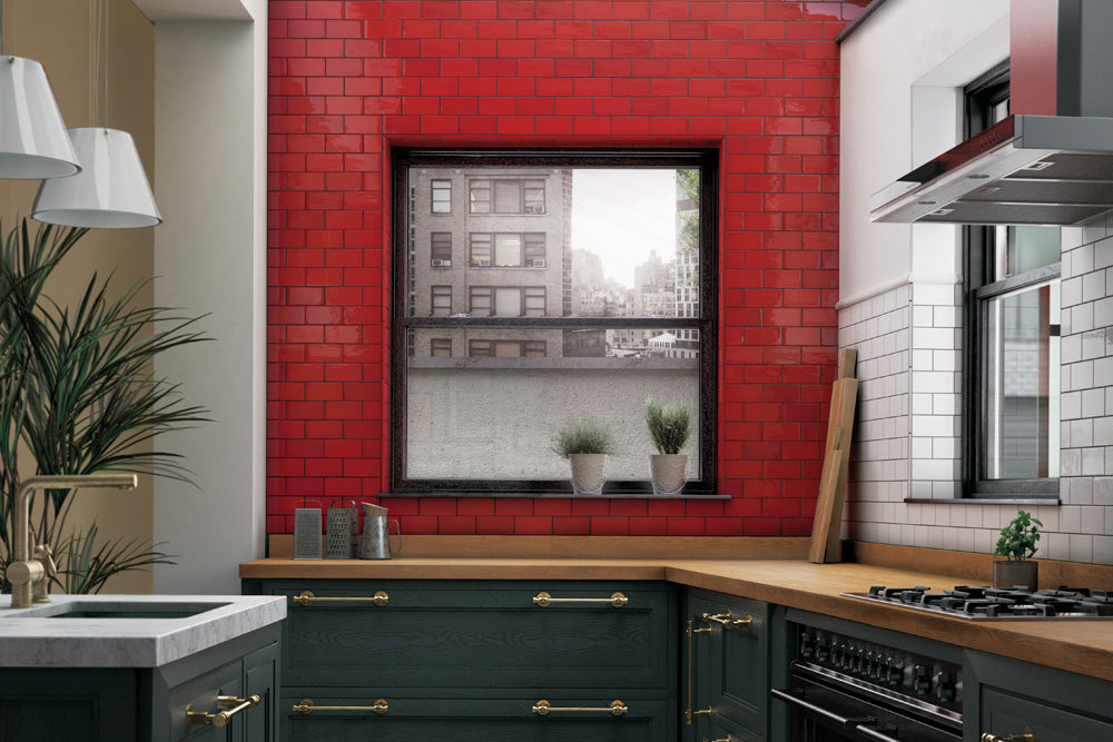 A bold and energetic atmosphere created with Village Volcanic Red 2.5X8 Glossy Ceramic, delivering fiery red hues that make a powerful visual impact.