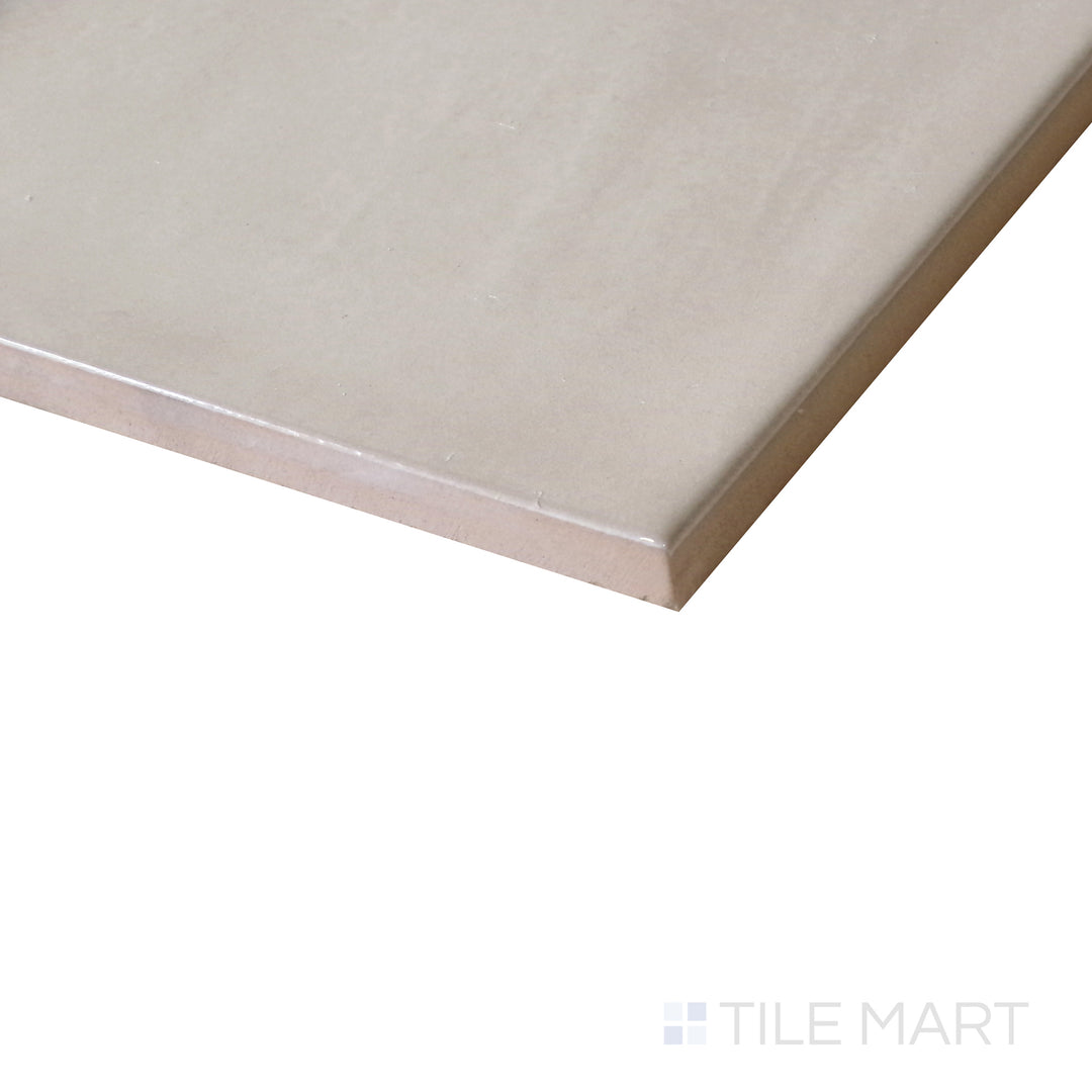 Angled shot of Village Mushroom 5x5 glossy ceramic tile, featuring warm mushroom tones, a polished finish, and a classic square shape.  