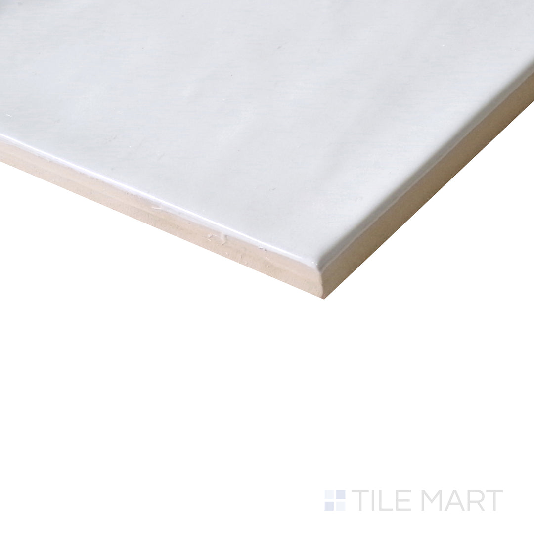 Slanted perspective of Village White 5x5 glossy ceramic tile, emphasizing its crisp white finish, reflective surface, and elegant square layout.  