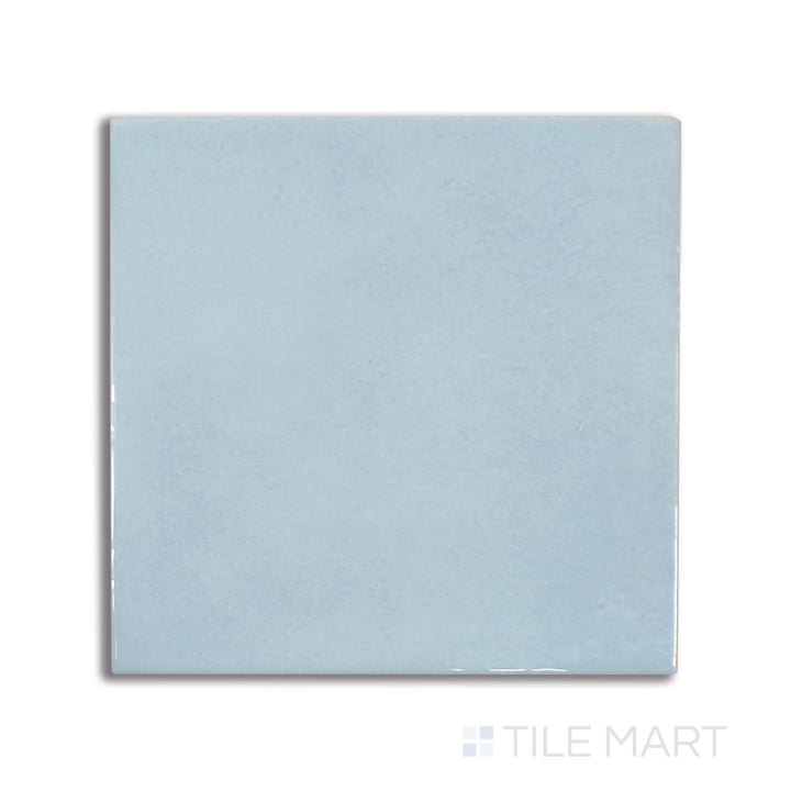Top-down view of Village Cloud 5X5 glossy ceramic tile, a muted gray shade with a reflective glaze for a soft yet modern touch.
