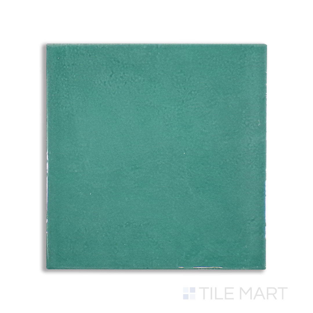 Overhead shot of Village Emerald Green 5X5 glossy ceramic tile, an eye-catching green tile with a rich, polished finish for a bold design element.