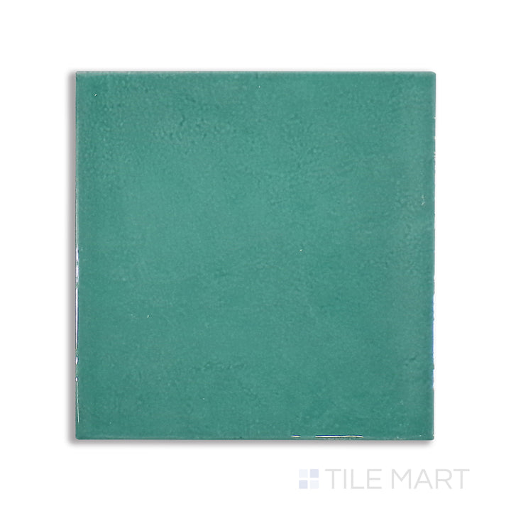 Overhead shot of Village Emerald Green 5X5 glossy ceramic tile, an eye-catching green tile with a rich, polished finish for a bold design element.