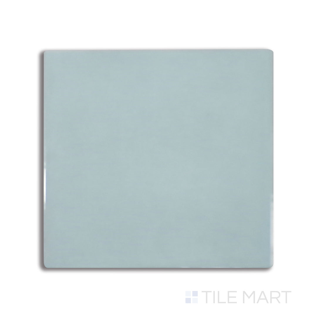 Flat-lay image of Village Mint 5X5 glossy ceramic tile, radiating freshness with its pastel green tone and smooth, glossy texture.