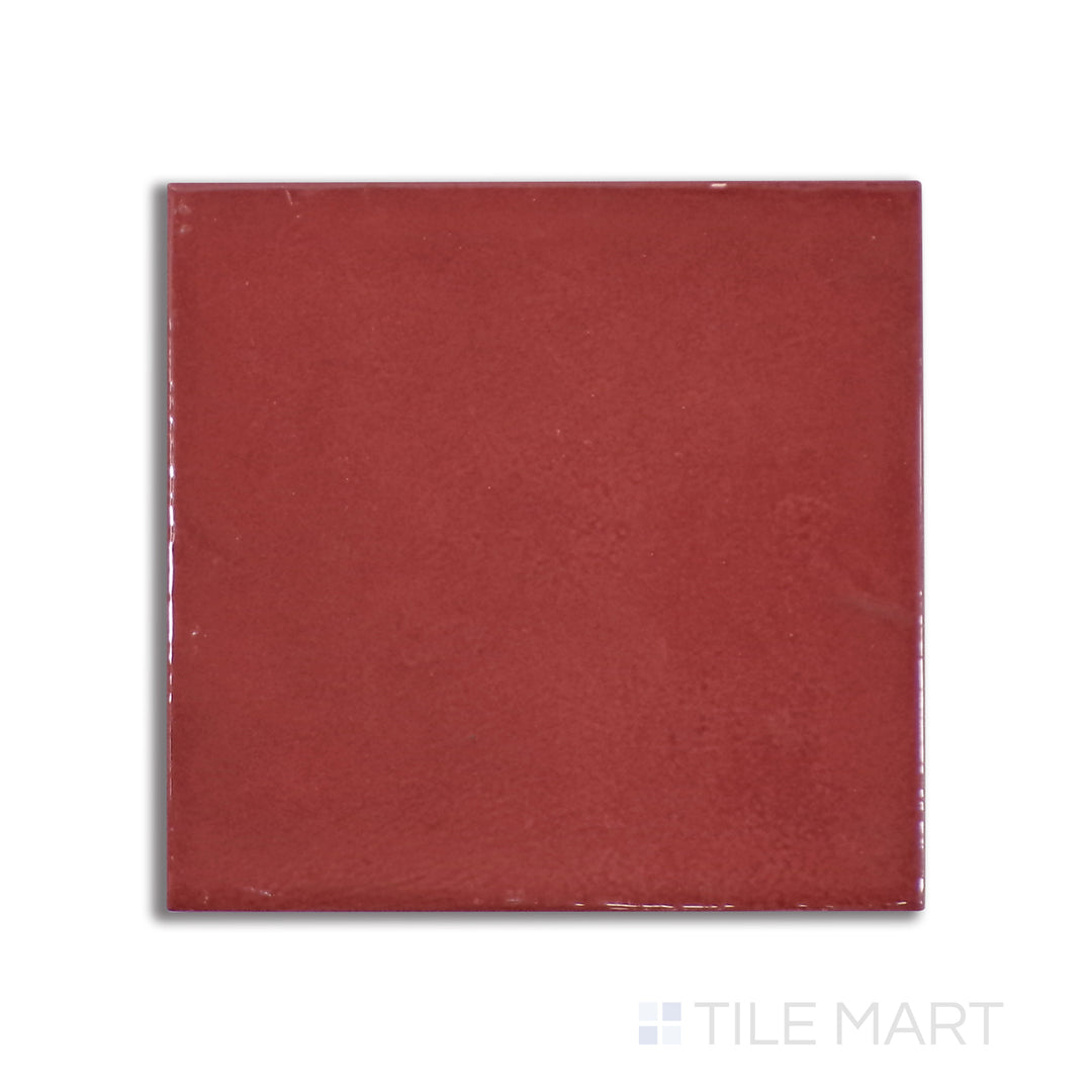 Aerial perspective of Village Volcanic Red 5X5 glossy ceramic tile, a vibrant red surface with a mirror-like shine that creates a bold statement.