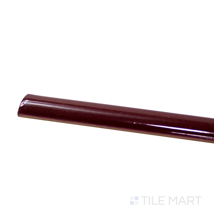Side perspective of Village Aubergine 0.5X8 Glossy Ceramic Jolly, capturing its rich purple shade with a high-shine, polished edge.