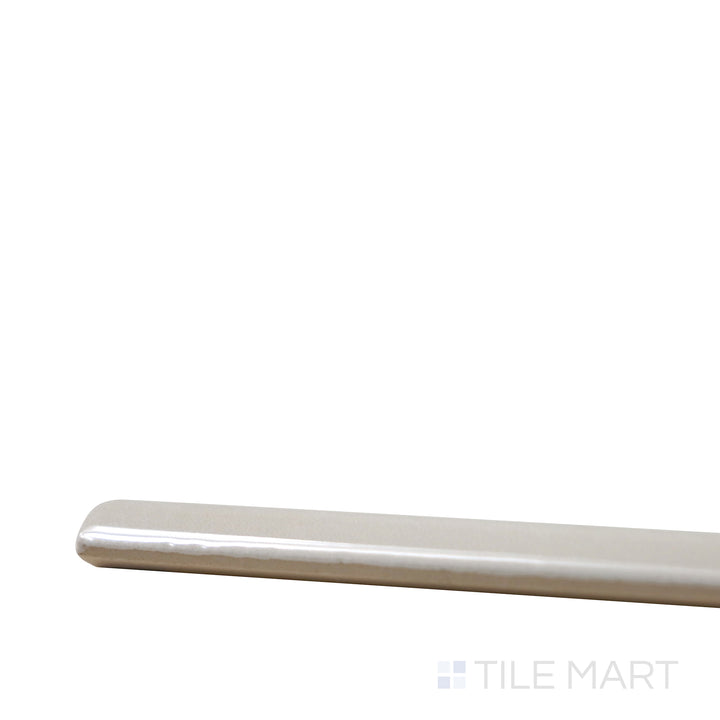Side perspective of Village Mushroom 0.5X8 Glossy Ceramic Jolly, capturing its warm earthy tones with a glossy edge for seamless installation.