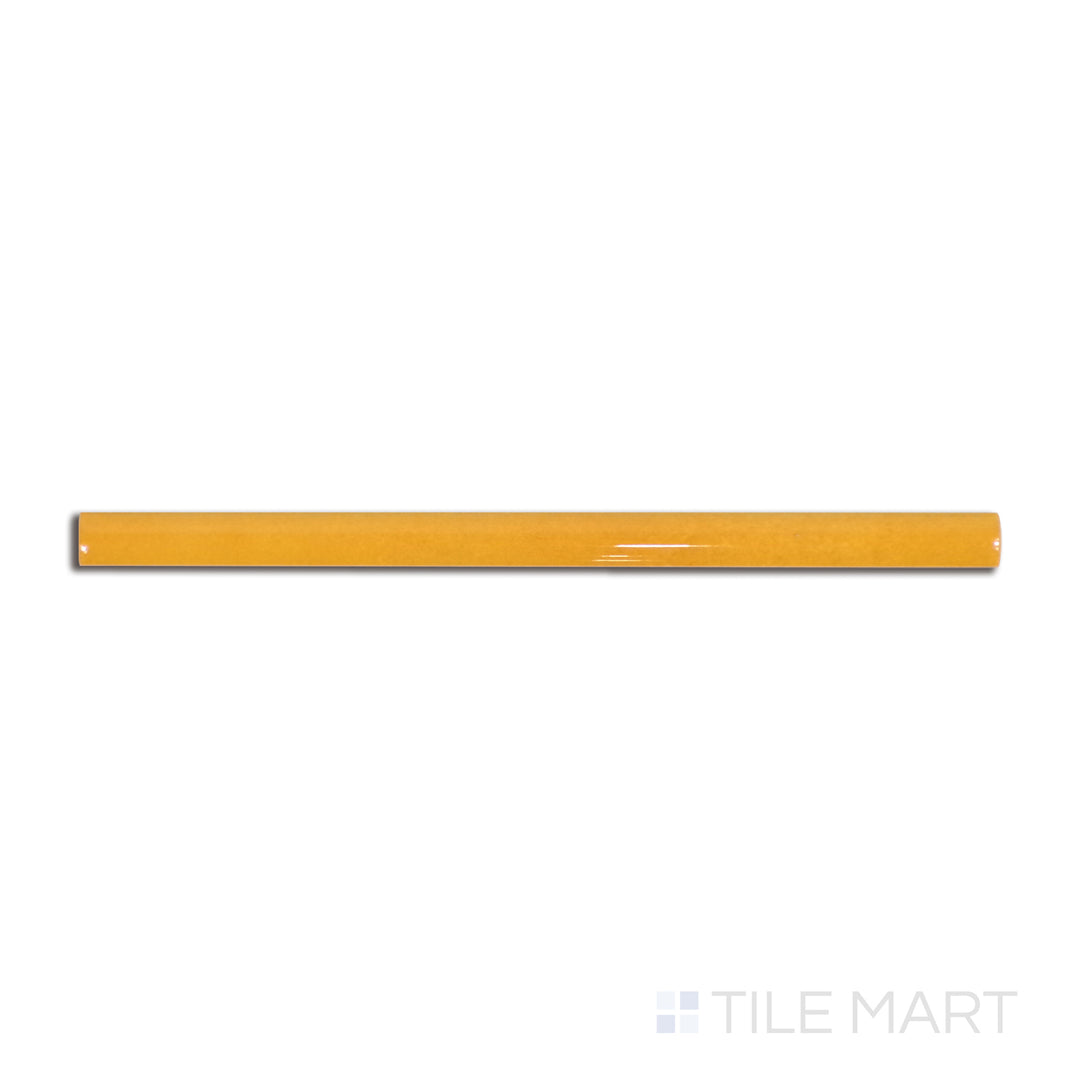 Overhead shot of Village Tuscany Gold 0.5X8 glossy ceramic jolly, a warm golden-hued border tile with a reflective glaze.