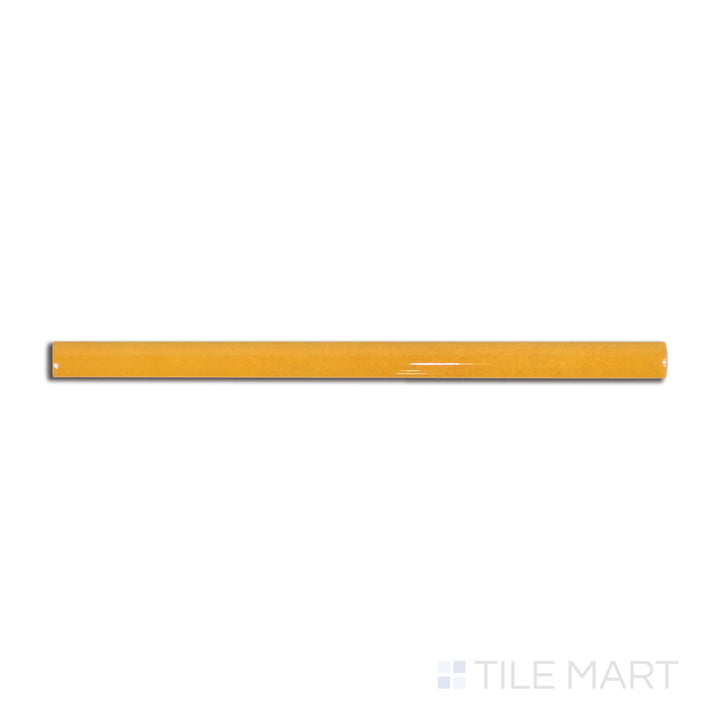 Overhead shot of Village Tuscany Gold 0.5X8 glossy ceramic jolly, a warm golden-hued border tile with a reflective glaze.