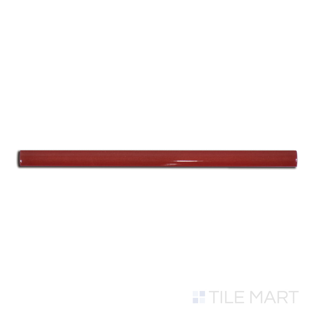 Flat-lay image of Village Volcanic Red 0.5X8 glossy ceramic jolly, a bold crimson ceramic trim piece with a high-gloss shine.