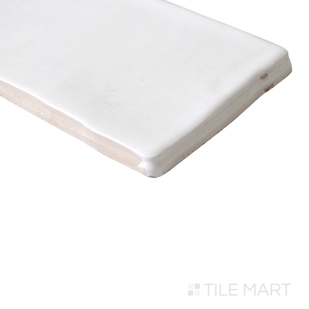 Diagonal view of Vitral Bianco 3x12 glossy ceramic tile, showcasing its classic white hue, polished glossy finish, and structured rectangular format.  