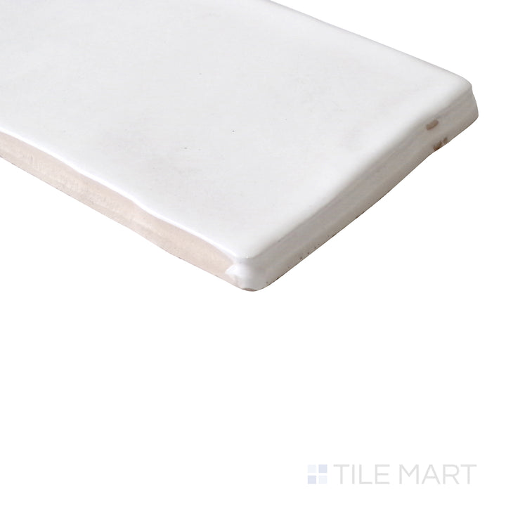 Diagonal view of Vitral Bianco 3x12 glossy ceramic tile, showcasing its classic white hue, polished glossy finish, and structured rectangular format.  