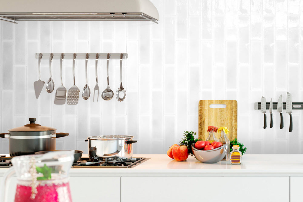 A bright and elegant setting enhanced by Vitral Bianco 3X12 Glossy Ceramic, offering a clean, luminous aesthetic that amplifies natural light and space.