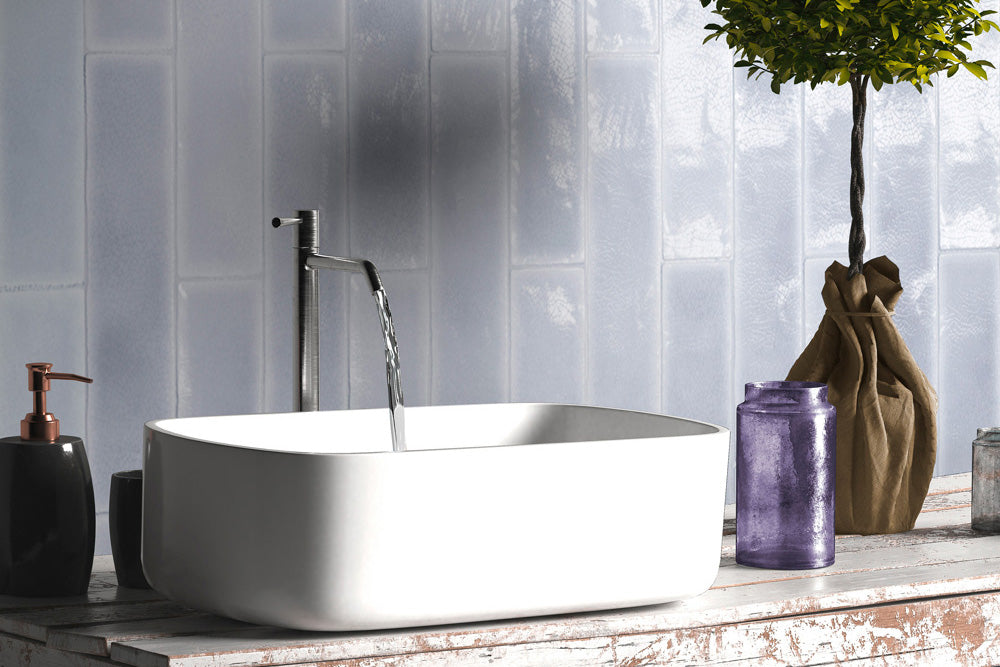 A soft and charming space designed with Vitral Lavanda 3X12 Glossy Ceramic, featuring a delicate lavender hue that brings warmth and sophistication.