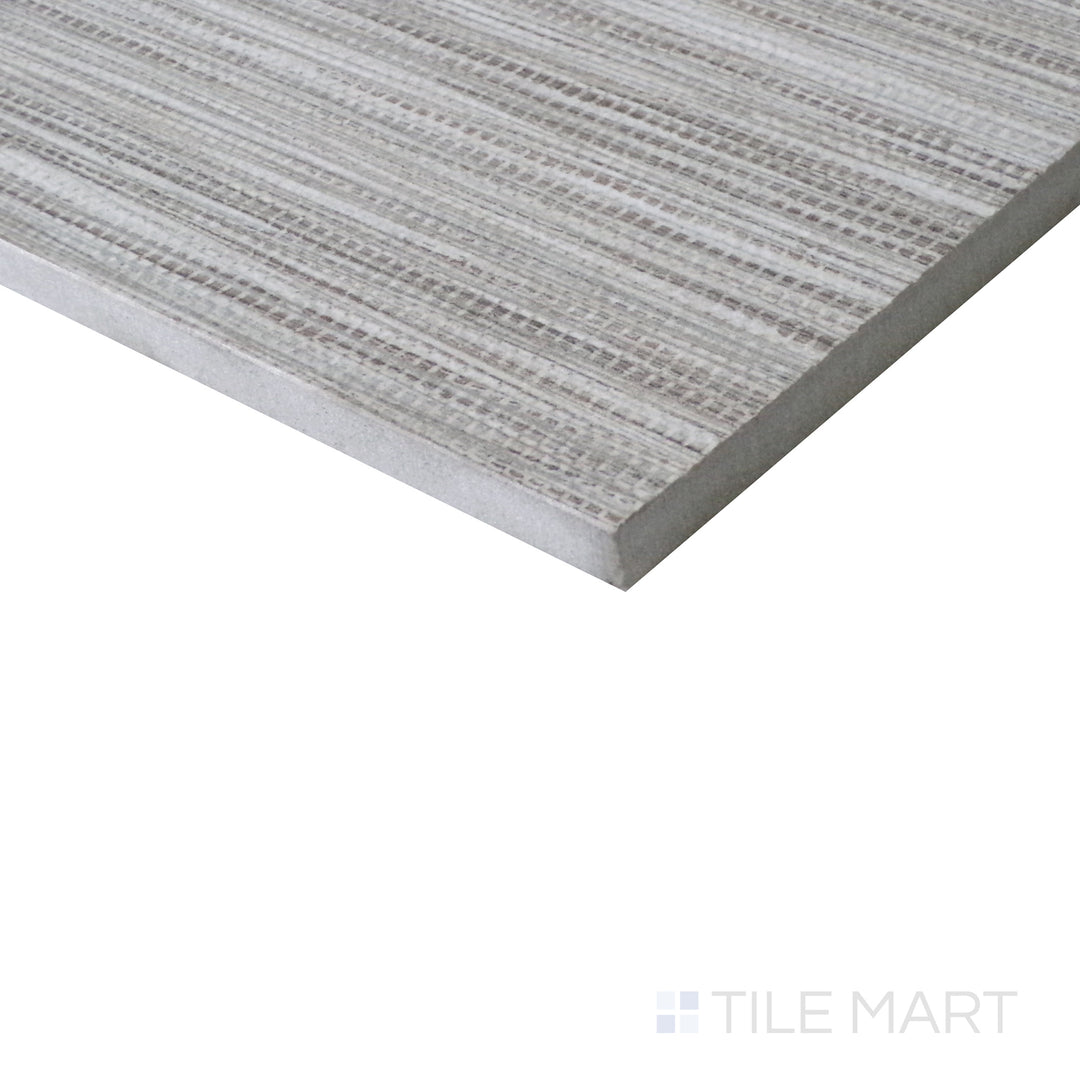 Diagonal view of Wooow Linen Biscuit 12x24 matte porcelain tile, showcasing warm biscuit hues, a subtle woven texture, and a modern matte surface.  