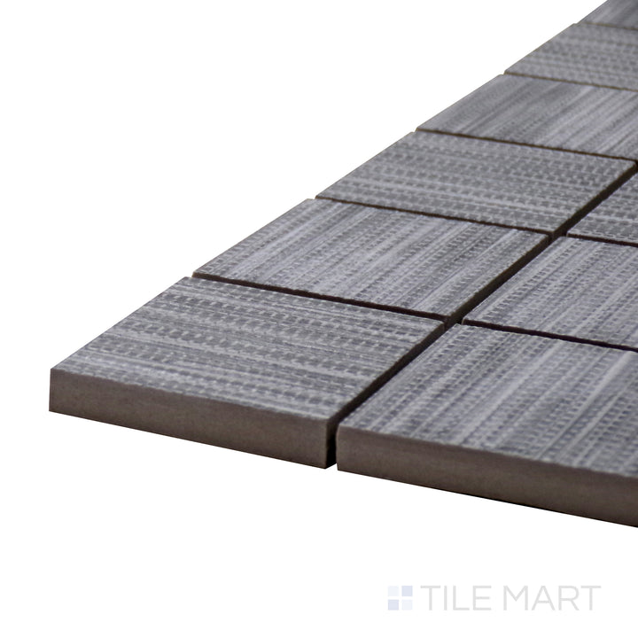 Side perspective of Wooow Linen Silver 2" Square Matte Porcelain Mosaic, capturing its elegant gray tones with a textured matte finish.