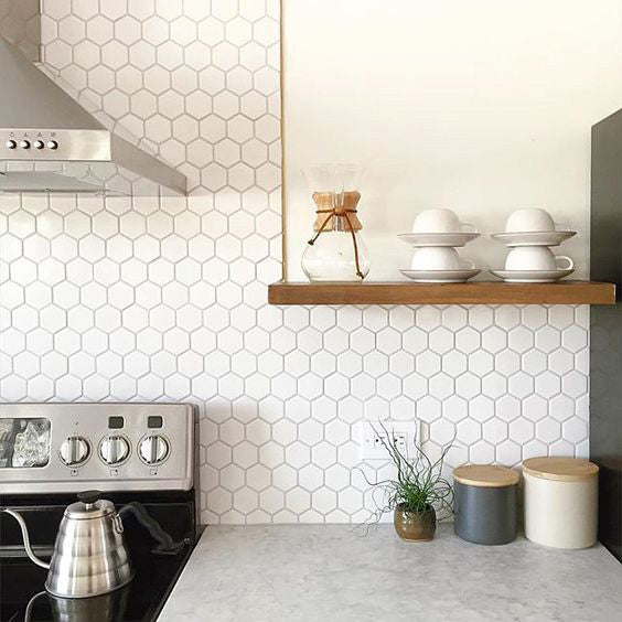A crisp and modern design brought to life with Retro White 2" Hexagon Glossy Porcelain Mosaic, featuring a clean, geometric layout that enhances spatial depth.