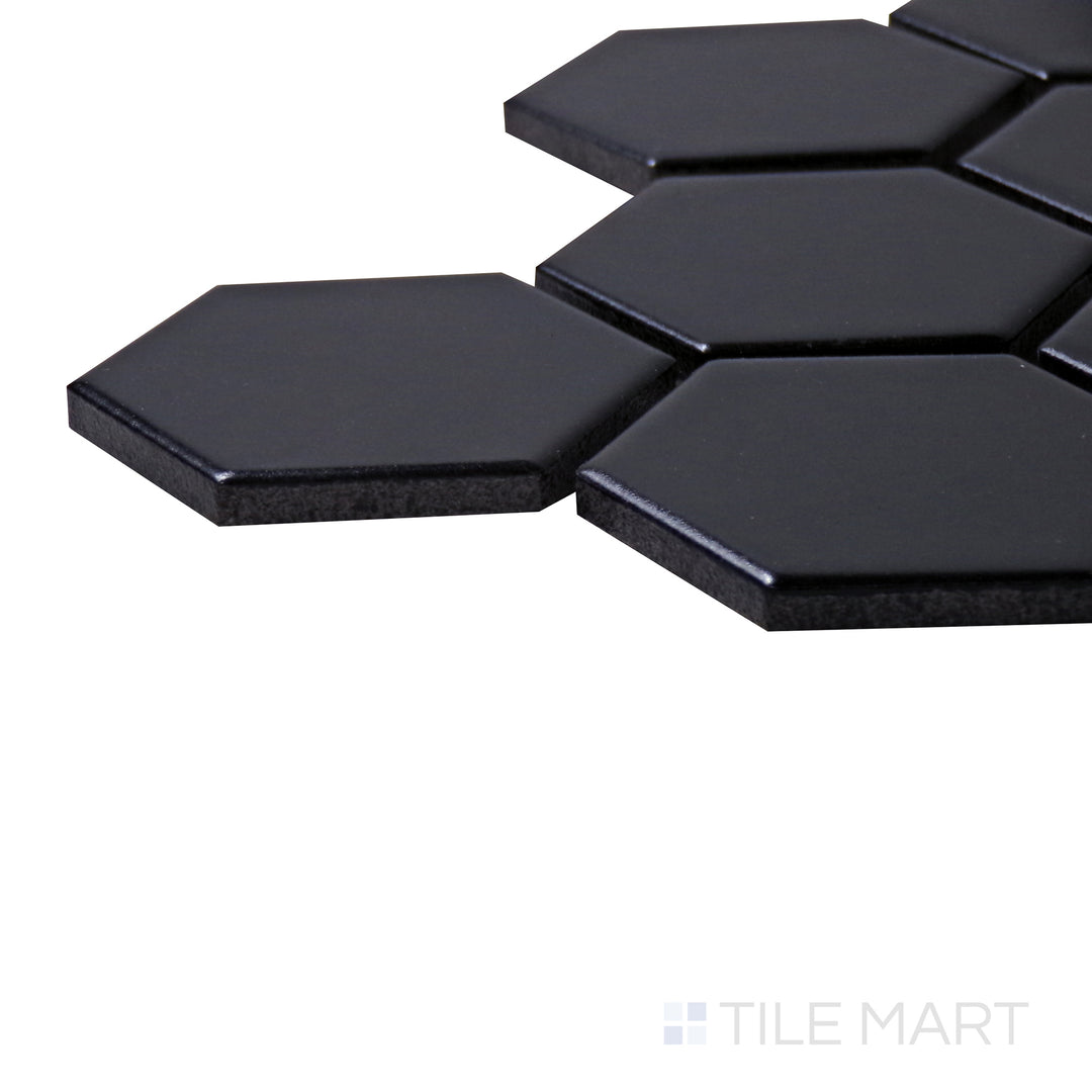Close-up corner shot of Retro Black 2" Hexagon Matte Porcelain Mosaic, featuring its bold black tones with a smooth, non-reflective surface.