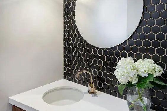 A sophisticated and timeless setting created with Retro Black 2" Hexagon Matte Porcelain Mosaic, offering a smooth, velvety texture that complements contemporary designs.