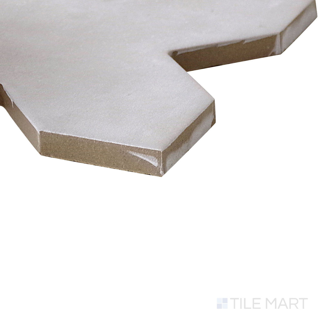 Corner shot of Kasbah Cross Smoke 5X5 Matte Porcelain Tile, featuring its soft gray tones with a subtle cross pattern and a smooth matte finish.
