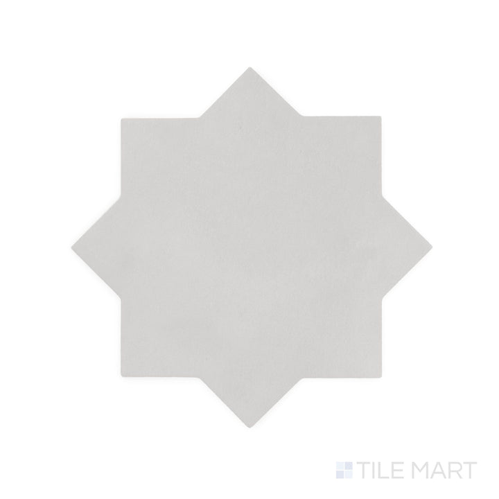Diagonal view of Kasbah Star Smoke 6.5x6.5 matte porcelain tile, showcasing its cool gray shade, intricate star pattern, and refined matte finish.  
