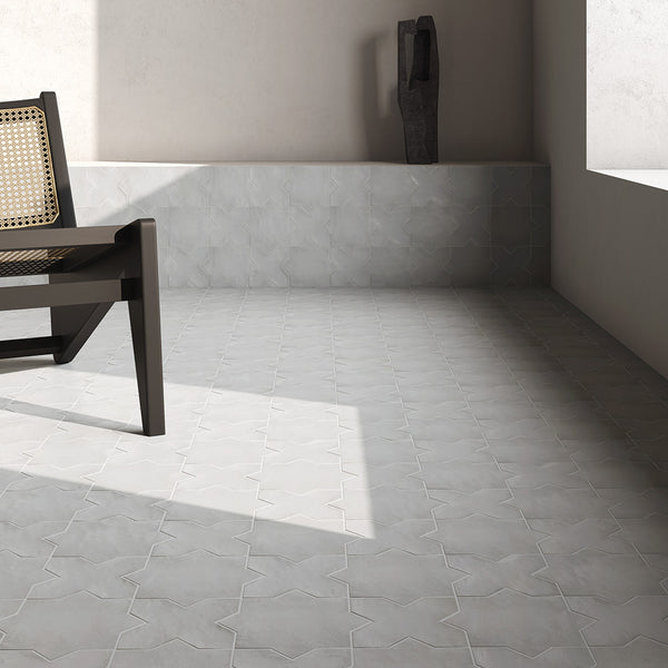 A bold and graphic statement created with Kasbah Star Smoke 6.5X6.5 Matte Porcelain, where deep gray tones meet intricate geometric artistry.