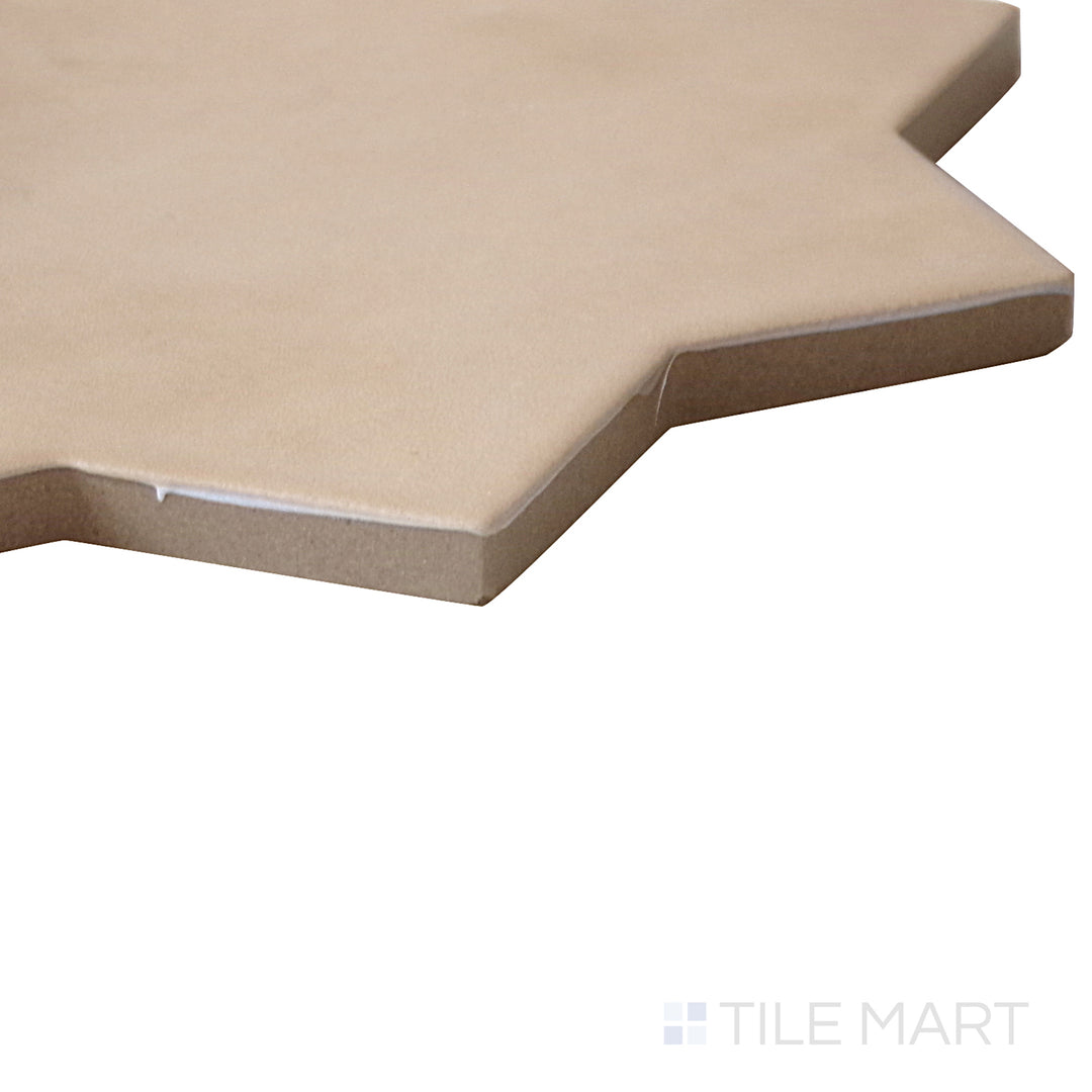 Slanted perspective of Kasbah Star Fawn 6.5x6.5 matte porcelain tile, emphasizing its warm fawn hues, subtle texture, and structured design.  