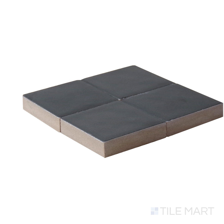 Corner angle of Kasbah Taco Black Hat 1X1 Matte Porcelain Tile, emphasizing its bold black shade with a modern matte finish.
