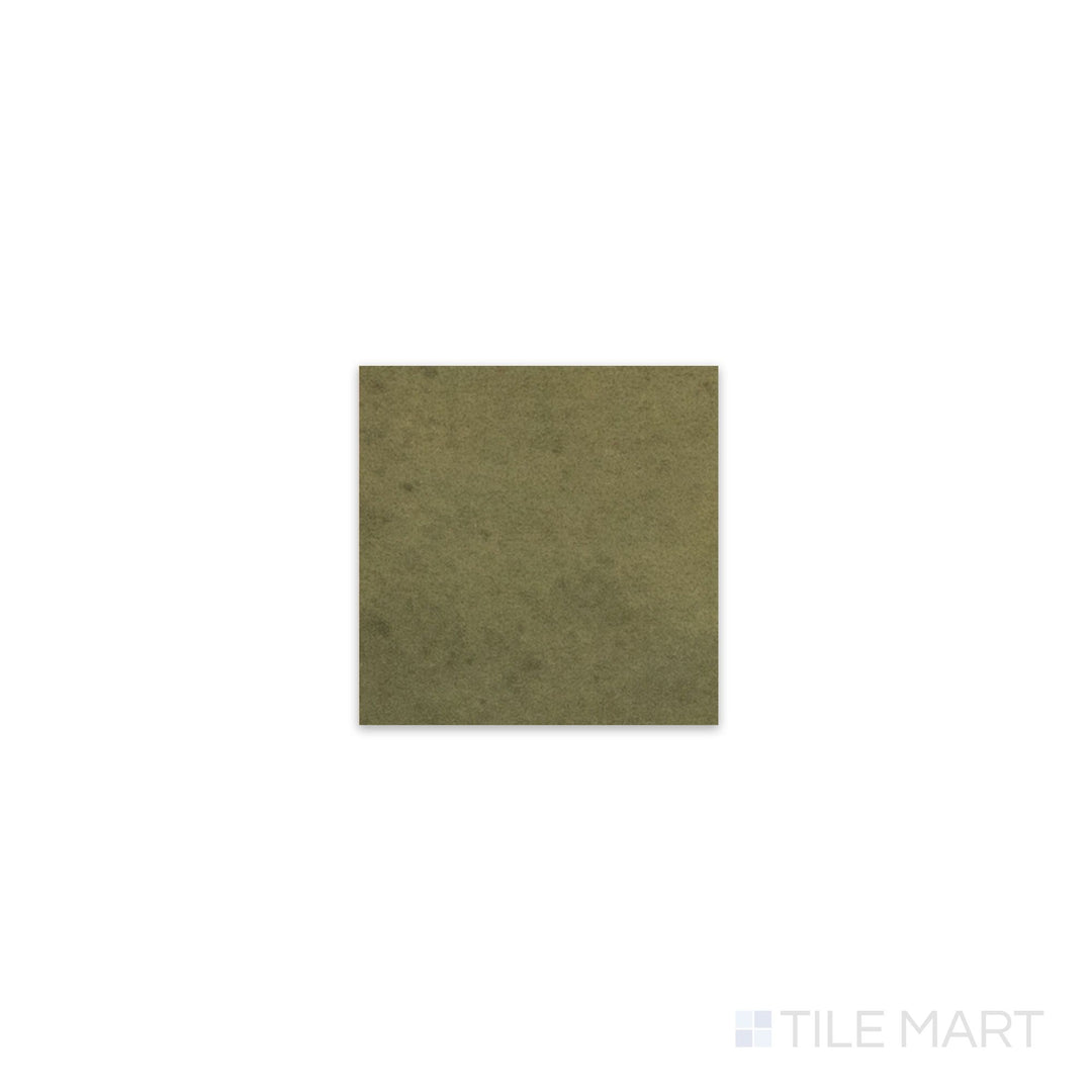 Diagonal view of Kasbah Taco Verde 1x1 matte porcelain tile, showcasing its vibrant green shade, modern matte texture, and structured small square format.  
