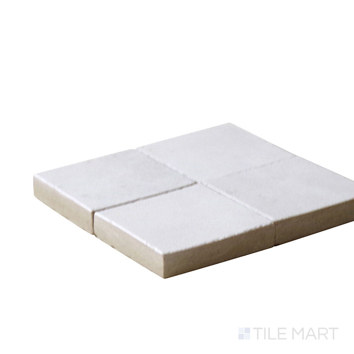 Close-up corner shot of Kasbah Taco Orchard Pink 1X1 Matte Porcelain Tile, featuring its delicate pink shade with a soft matte finish.
