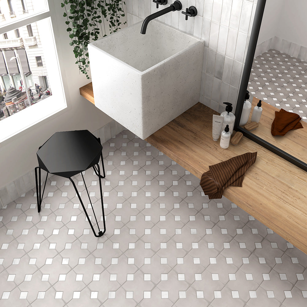 A crisp, clean aesthetic created with Kasbah Taco White 1X1 Matte Porcelain, adding a minimalist yet striking presence.