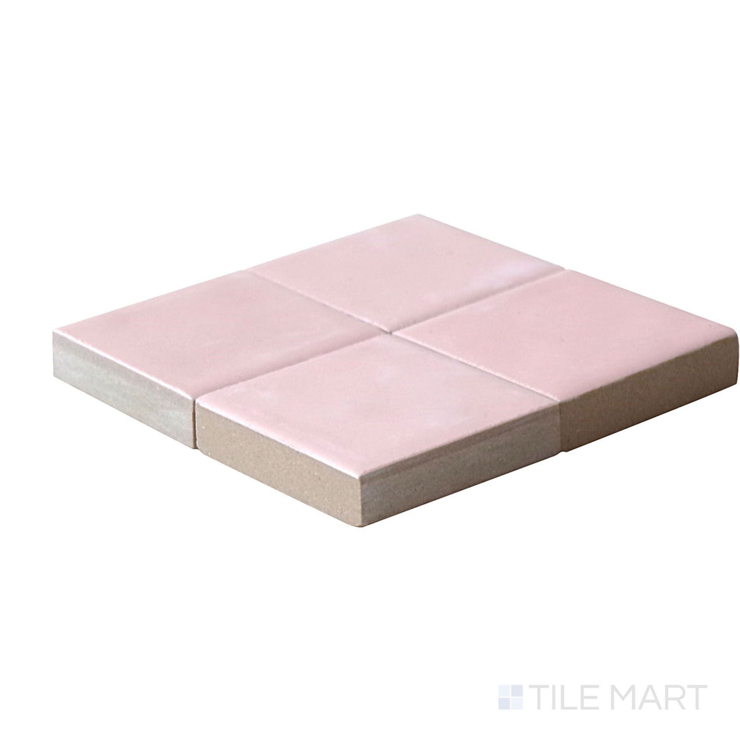 Close-up corner shot of Kasbah Taco Orchard Pink 1X1 Matte Porcelain Tile, featuring its delicate pink shade with a soft matte finish.
