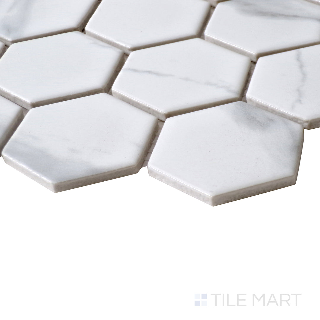 Diagonal view of Porcelain Glazed Mosaics Carrara White 2" square matte tile, showcasing its refined white tones, soft gray veining, and structured square layout with a matte surface.  