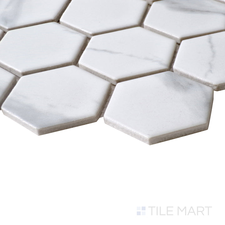 Diagonal view of Porcelain Glazed Mosaics Carrara White 2" square matte tile, showcasing its refined white tones, soft gray veining, and structured square layout with a matte surface.  