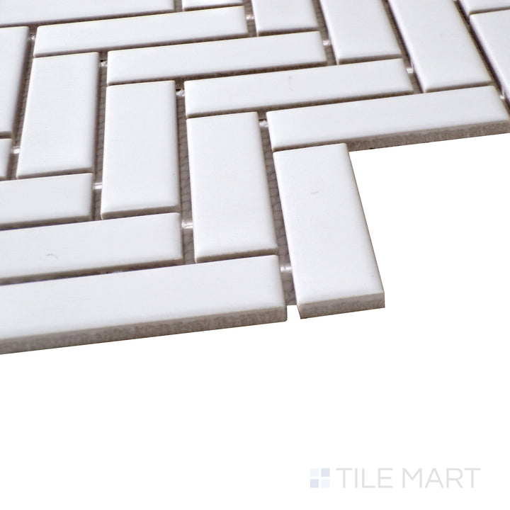 Diagonal view of Porcelain Glazed Mosaics White Herringbone matte tile, showcasing its crisp white tone, intricate herringbone pattern, and smooth matte surface.  