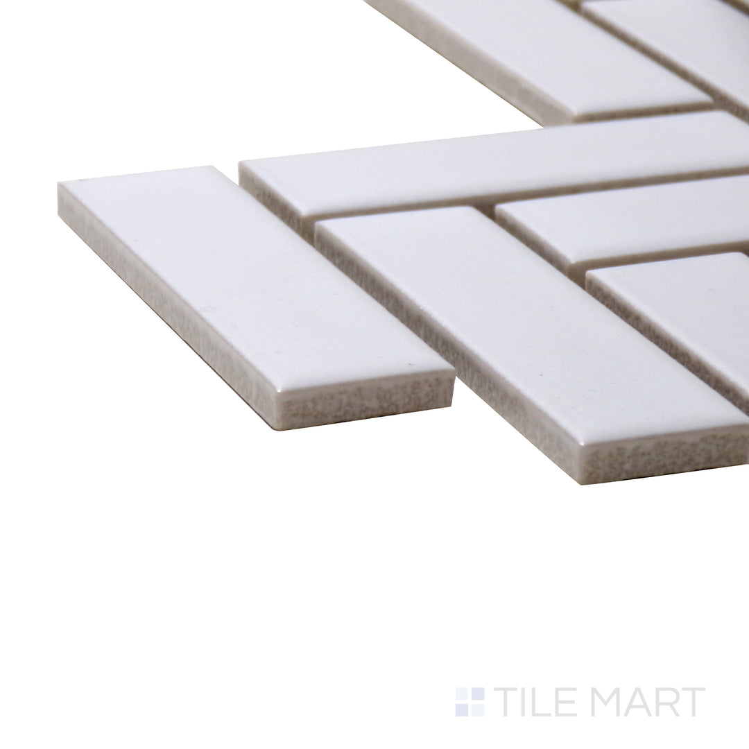 Side perspective of Porcelain Glazed Mosaics White Herringbone Matte Tile, capturing its sophisticated white surface arranged in a stylish herringbone pattern with a matte finish.