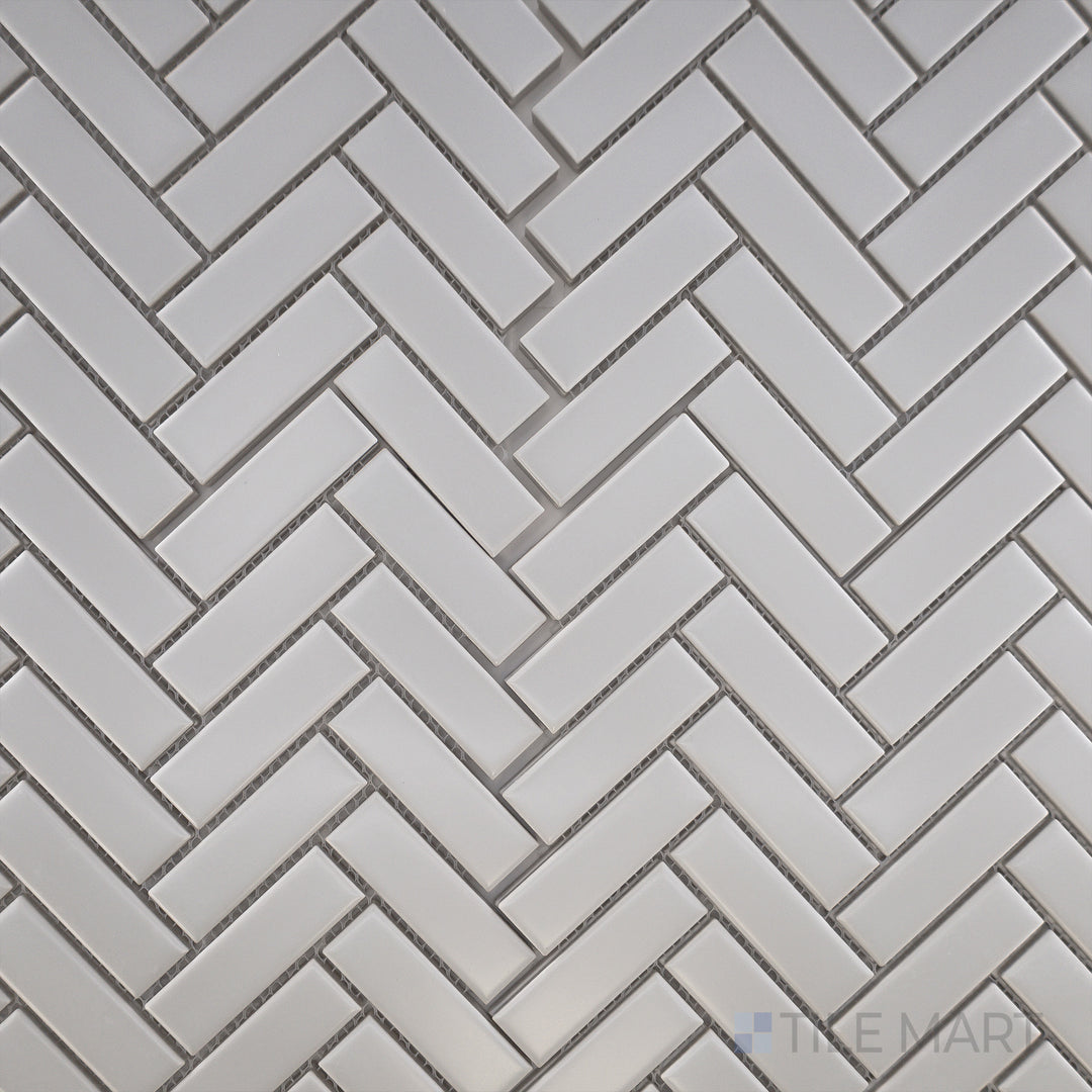 Overhead view of Porcelain Glazed Mosaics Grey Herringbone Matte, featuring a stylish gray tile arrangement in a herringbone layout for a modern touch.