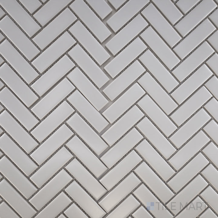 Overhead view of Porcelain Glazed Mosaics Grey Herringbone Matte, featuring a stylish gray tile arrangement in a herringbone layout for a modern touch.