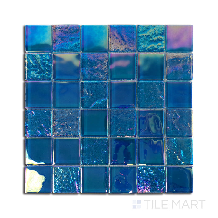 Top-down shot of Vidrofina Ocean Blue 2" Square Glossy Glass Mosaic, a deep blue glass mosaic reflecting oceanic tones with a high-gloss surface.