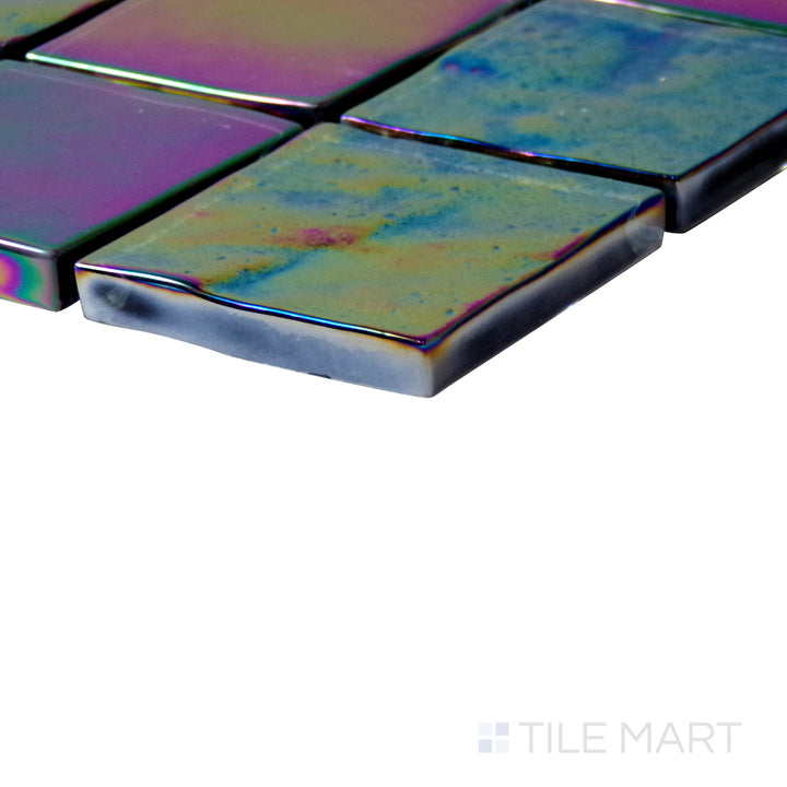 Diagonal view of Vidrofina Anochrome 2" square glossy glass mosaic, showcasing its sleek neutral tones, reflective glossy surface, and uniform square arrangement.  