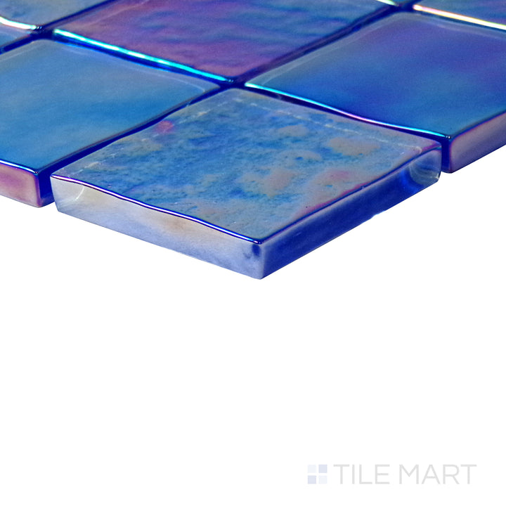 Angled shot of Vidrofina Cobalt Blue 2" square glossy glass mosaic, featuring an intense cobalt blue color, a sleek glossy surface, and structured square design.  