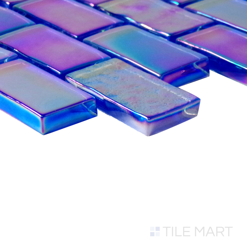 Angled shot of Vidrofina Cobalt Blue brick glossy glass mosaic, featuring a deep cobalt blue hue, a polished glossy surface, and a structured brick layout.  
