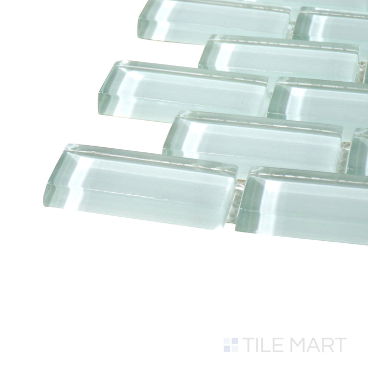 Angled close-up of Vidrofina Maritime White Brick Glossy Glass Mosaic, showcasing its bright white surface with a smooth, glossy brick arrangement.