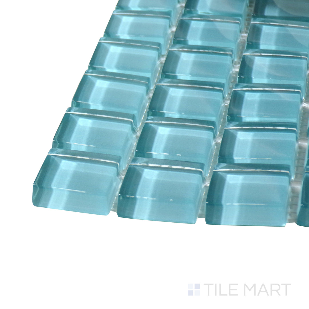 Corner angle of Vidrofina Larimar Green 1" Square Glossy Glass Mosaic, emphasizing its natural greenish-blue tones with a smooth, highly reflective surface.